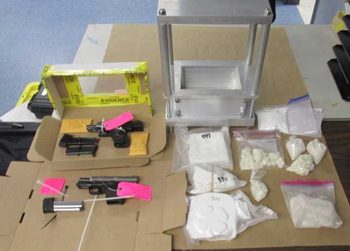 Some of the drugs and weapons seized.