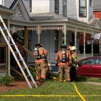 <p>Firefighters at the scene of an Allyn Street fire in Holyoke on Friday, June 11.</p>