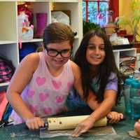 <p>Youngsters help out in the kitchen at HealthBarn USA, coming to Ridgewood in December.</p>