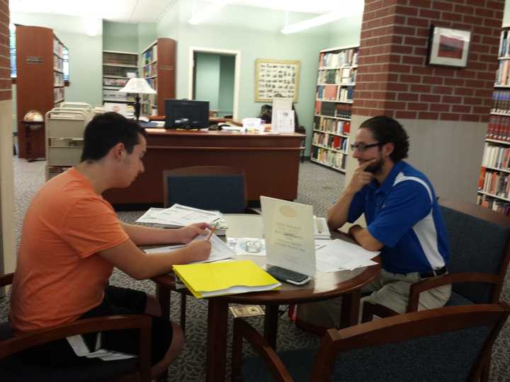 Lazaro Conde (left) and Stephen Lacatena studying at the Ridgefield Public Library. 