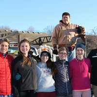 <p>Wooster School students deliver the 129 turkeys donated for Thanksgiving meals. </p>