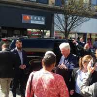 <p>Former President Bill Clinton waving to people along Martine Avenue in White Plains during an April visit.</p>