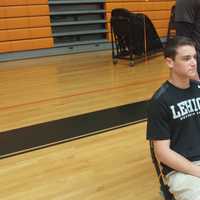 <p>From left, Eric Greenberg, Jason Bienstock and Chris Conley wear their respective college shirts during a ceremony recognizing Mamaroneck High seniors&#x27; who aim to compete in college. All three Tigers have committed to college lacrosse teams.</p>