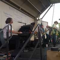 <p>The Mighty Spectrum Band, a local rock group, plays for a large crowd at Clarkstown&#x27;s Fourth of July celebration.</p>