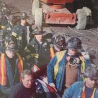 <p>New York City firefighters carry the remains of a fallen colleague from the site of the World Trade Center terror attacks in 2001.</p>