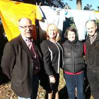 <p>Trumbull Rotary Club President Ed Gillespie, Center for Family Justice President and CEO Debra A. Greenwood and Rotarians Sue Horton and Steve Hodson stand in front of The Clothesline Project in Trumbull.</p>