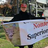 <p>Amy Atkinson, left, and Val Devine demonstrate across the street from The Commons in Saddle River Saturday afternoon.</p>