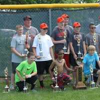 <p>Players and coaches from Major league champions VFW pose with the trophy.</p>