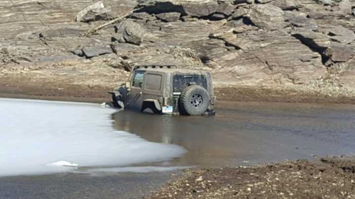 A man was arrested after driving and getting stuck in the Easton Reservoir, police said.