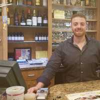 <p>George Siderias behind the register at the River Edge Diner.</p>