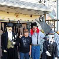 <p>Theresa and Richard Fuss of Elmwood Park with a small fraction of their Halloween display.</p>