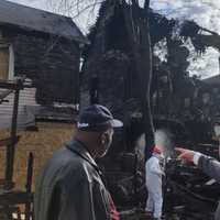 <p>Bridgeport Fire Deputy Chief Lance Edwards, left, and Mayor Joe Ganim survey a blighted building being torn down on Newfield Avenue.</p>