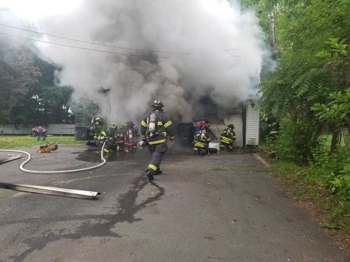 Danbury firefighters battle a garage fire.