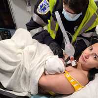 <p>Emily Hardman in the ambulance with baby Rosemary.</p>