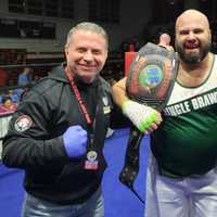 <p>Elmwood Park Police Officer Mike Sammarone with Elmwood Park Police Chief Michael Foligno and UFC Bare Knuckles Boxer Jimmie Rivera</p>