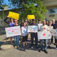 <p>A group of well-wishers welcomed the migrants to the Red Roof Inn in Poughkeepsie.</p>