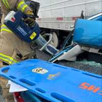 <p>A Grantville Volunteer Fire Company member uses the jaws of life to free the driver.&nbsp;</p>