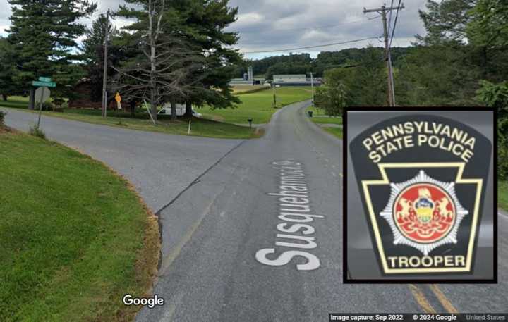 A Pennsylvania State Police vehicle and the intersection where the stabbing happened, according to troopers.&nbsp;