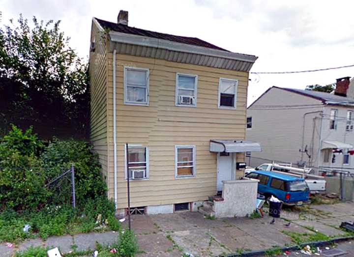 Paterson detectives raided this Mill Street house on Saturday.