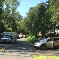 <p>Weston Volunteer firefighters and Weston EMS respond to the car vs. motorcycle crash on Cartbridge Road on Sunday.</p>