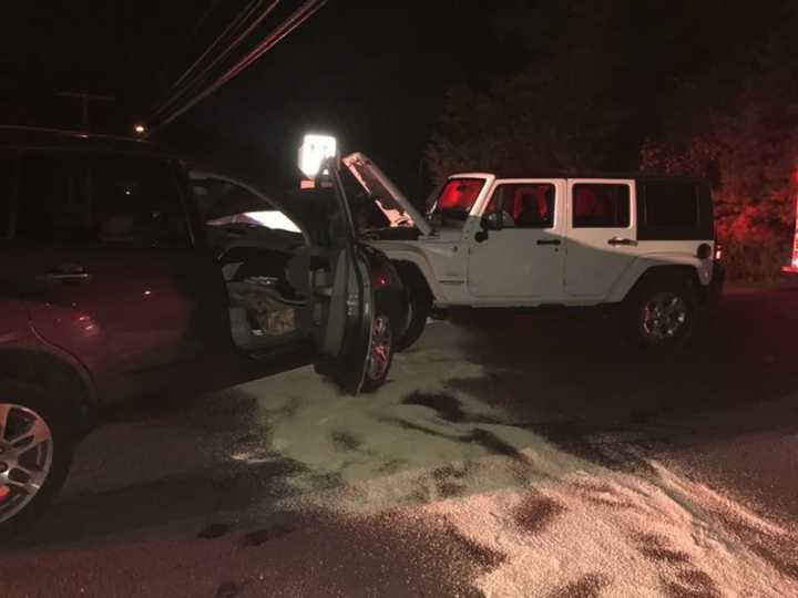 The two-vehicle crash blocked the intersection at Weston Road and Newtown Turnpike in Weston late Saturday.