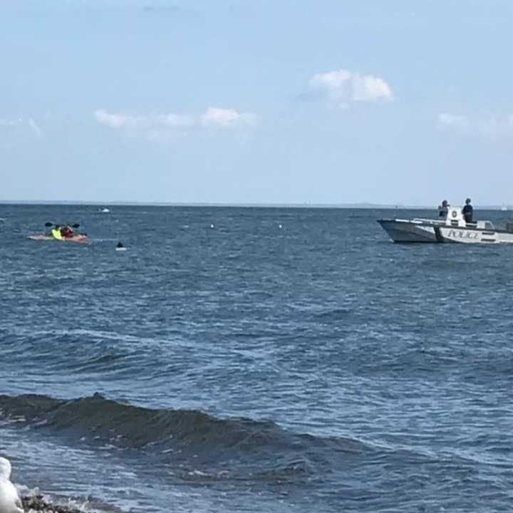 Westport Marine police come to the aid of a capsized kayaker off South Beach at Compo on Sunday.