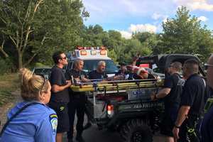 First Responders Tend To Cyclist Injured During Trail Ride At Lake Mohegan