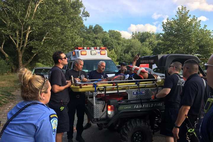 First Responders Tend To Cyclist Injured During Trail Ride At Lake Mohegan
