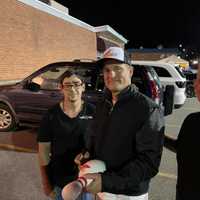 <p>Woody Harrelson with Larry Perlitz and fans at the bowling alley.</p>