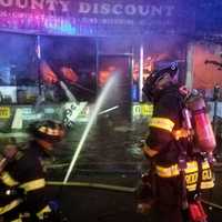 <p>Flames consume County Discount.</p>