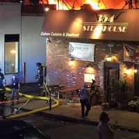 <p>The fire blew through the roof of A.J.&#x27;s Pharmacy, responders said.</p>