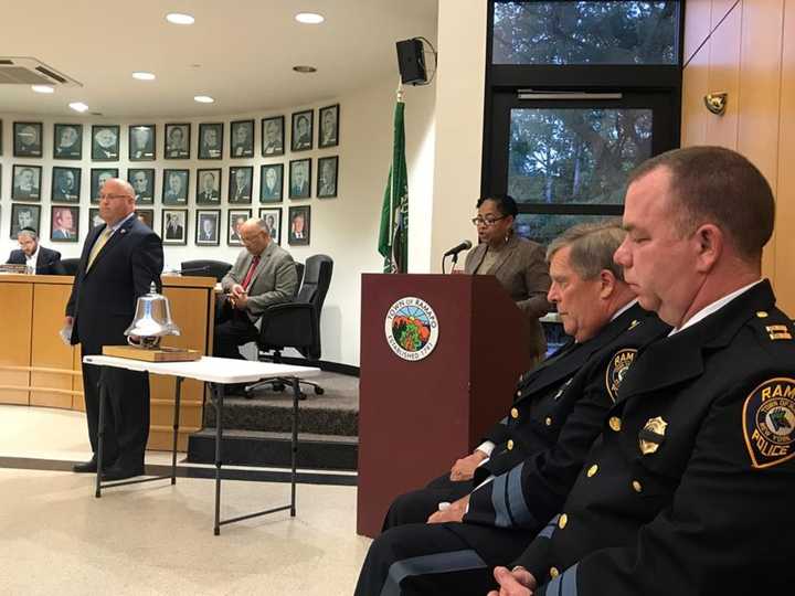 Deputy Supervisor Brendel Charles reads names of Ramapo residents who perished in the Sept. 11 attacks while Councilman Pat Withers rings the remembrance bell provided by the Monsey Fire Department.