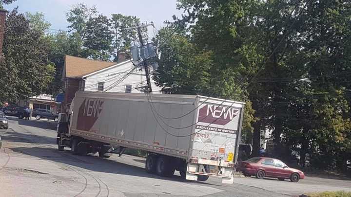 A section of Orchard Street is closed after a delivery truck hit a utility pole.