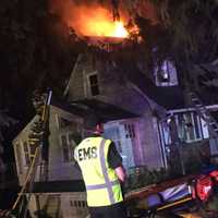 <p>Firefighters from several departments battled the three-alarm blaze, which broke out just before 2:30 a.m. on Sunrise Drive.</p>