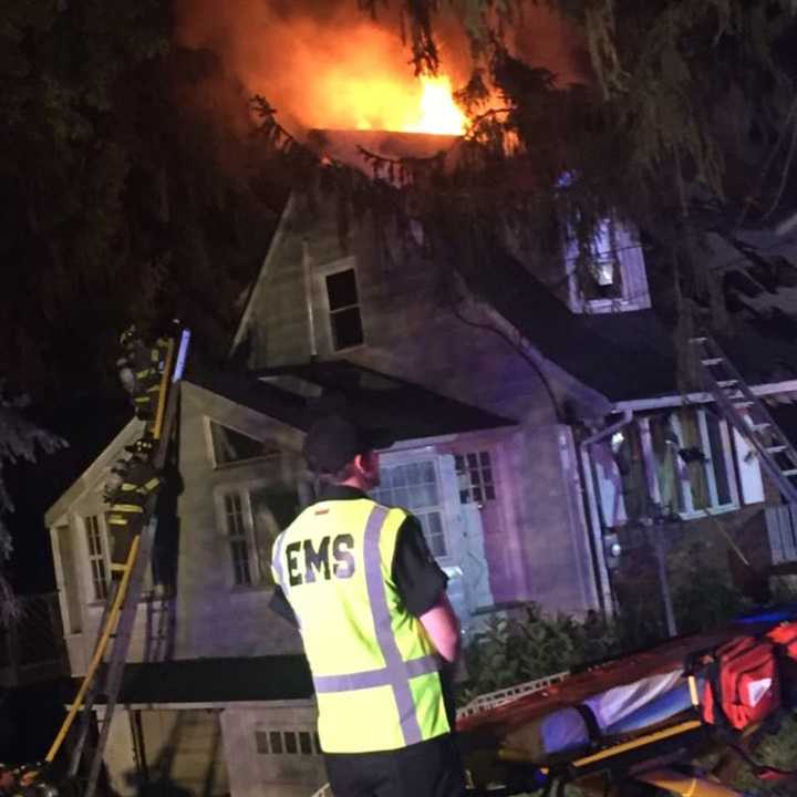 Firefighters from several departments battled the three-alarm blaze, which broke out just before 2:30 a.m. on Sunrise Drive.