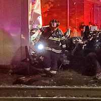 <p>Hackensack firefighters cut the top off of the Honda Ridgeline&#x27;s cab after the truck was struck shortly before midnight at the Central Avenue crossing.</p>