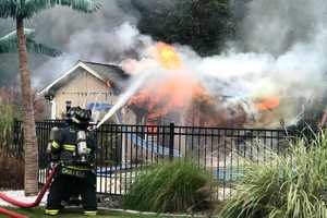 Firefighters Extinguish Burning Pool House In Trumbull