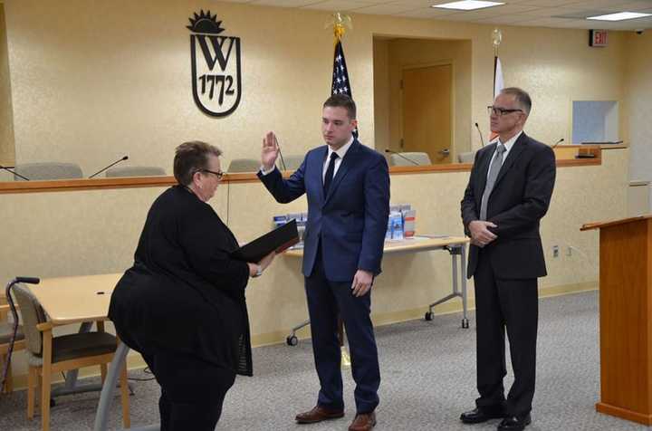 Daniel Hudson is sworn in as a Wallkill Police officer by Town Clerk Louisa Ingrassia.