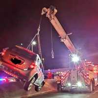 <p>Heavy duty wrecker removes the SUV.</p>