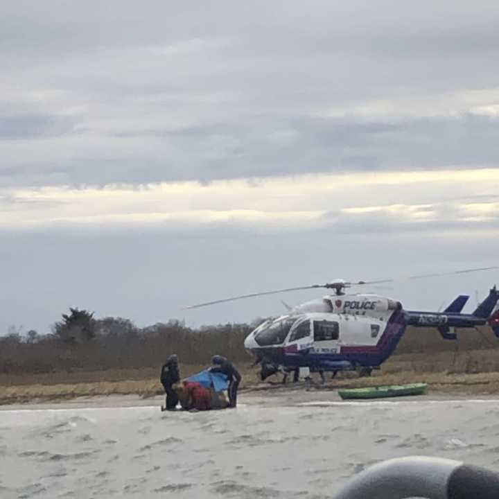 Authorities rescued a man after his kayak capsized in Mastic Beach.