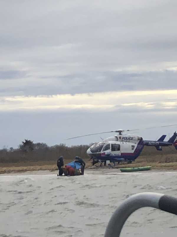 Watch: Officers Rescue Man Clinging To Kayak In Mastic Beach