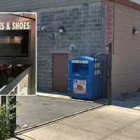 <p>The clothing bin behind the Broadway apartment building in Paterson where the woman was trapped.</p>