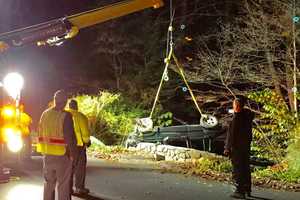 Vehicle Rolls Down Embankment In Brookfield