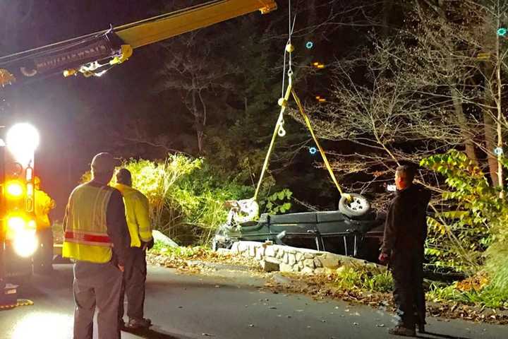 Vehicle Rolls Down Embankment In Brookfield
