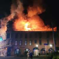 <p>A three-alarm fire in New Hartford has destroyed a historic building that includes apartments and businesses.</p>