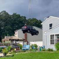 <p>Removing the Jeep from the pool.</p>