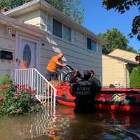 <p>New Jersey State Police rescue residents trapped in houses.</p>