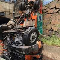 <p>The driver and a victim on the roadway above were hospitalized in critical condition, responders said.</p>