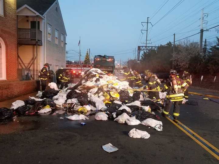 The load of burning trash was dumped onto the road to keep it from spreading the garbage truck, Fairfield firefighters said.