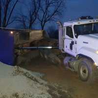 <p>The bed of a dump truck overturned while workers were unloading cargo in New Hempstead.</p>